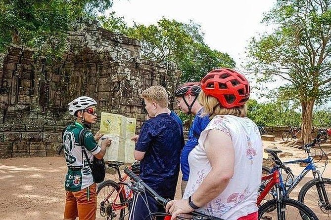 Angkor Sunrise Bike Tour with Breakfast & Lunch - Pickup, group size, and the long day