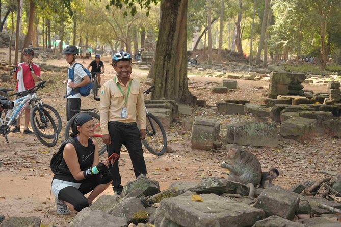 Angkor Sunrise Bike Tour with Lunch Included - Bayon’s carved faces and the value of a guide