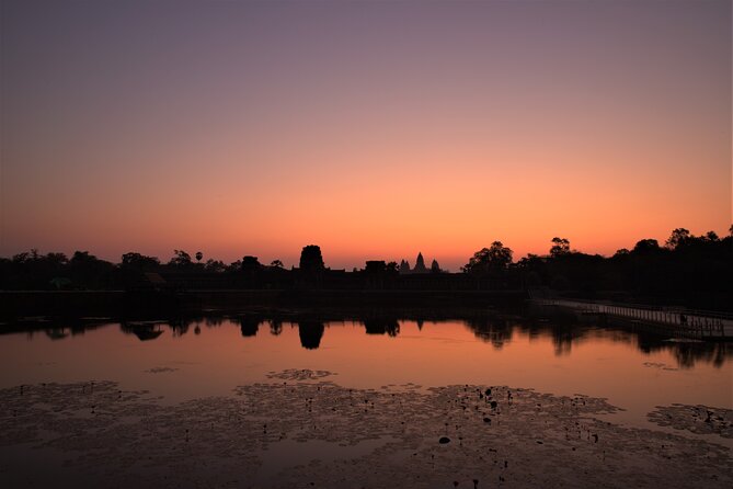 Angkor Sunrise Expedition Cycling Through Serene Backroads - Bayon and the famous stone faces