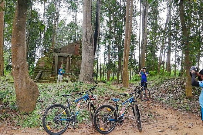Angkor Temple Bike Tour from Siem Reap Inclusive of Lunch - Riding from town toward Angkor Wat