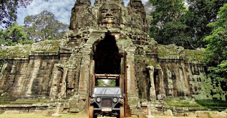 Angkor Wat in a vintage Jeep with driver - jeep rental - Ta Prohm and the trees growing through stone