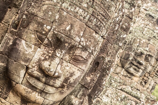 Angkor Wat Small Group Tour Inclusive lunch - The first temple stop: jungle atmosphere and carved stone