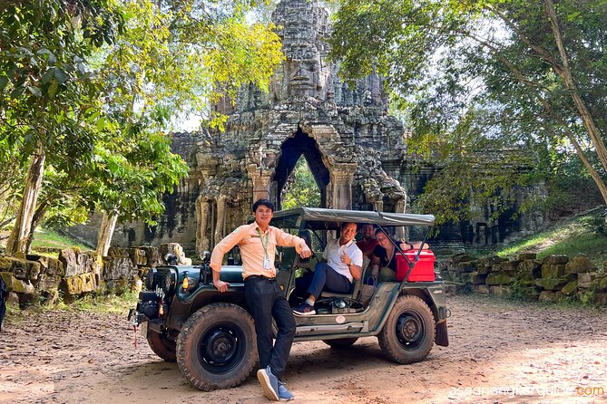 Angkor Wat Sunrise and Market Tour by Jeep - Ta Prohm, where trees take over the ruins