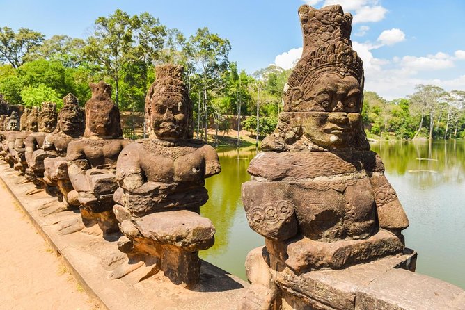 Angkor Wat Sunrise or Sunset Tour with Guide from Siem Reap - South Gate and Bayon: two hours among Angkor Thom’s faces