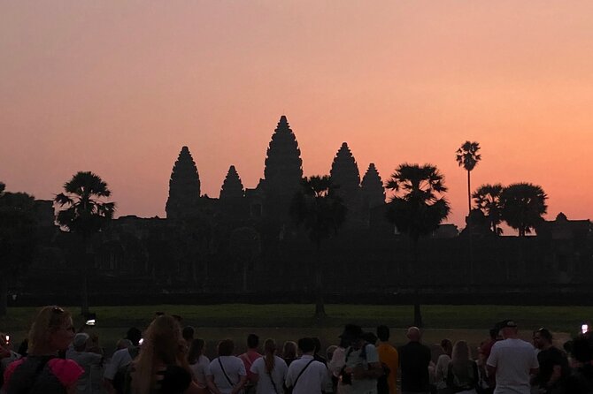 Angkor Wat Sunrise Shared Tour with Guide and Bus - Bayon’s many carved faces