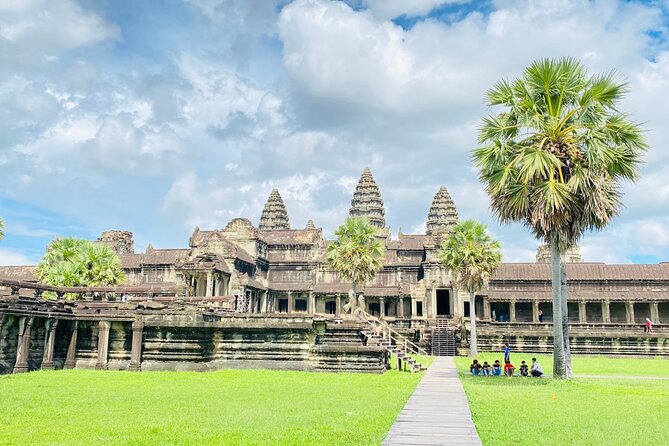 Angkor Wat Sunrise Shared Tour with Guide and Bus - Ta Prohm and the trees over the ruins