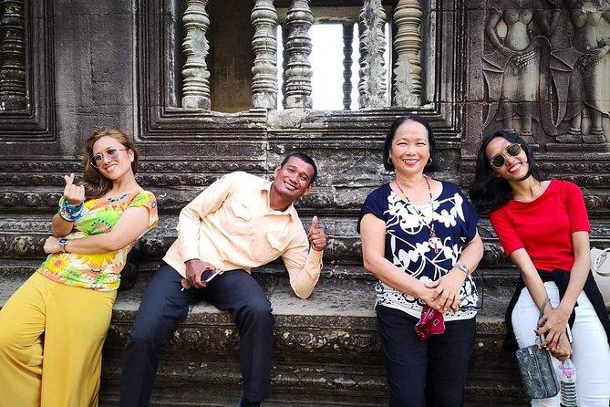 Angkor Wat Sunrise tour with Small - Group and Guide tours - Angkor Thom and Bayon: a grand entrance and stone faces