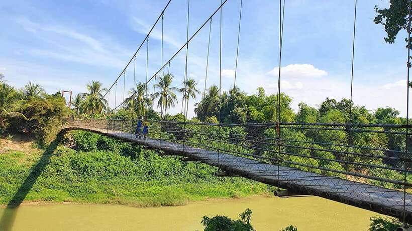 Battambang: Tuk-Tuk, Bamboo Train, Killing/Bat Caves, Sunset - Villages, fruit plantations, and a wobbly bridge