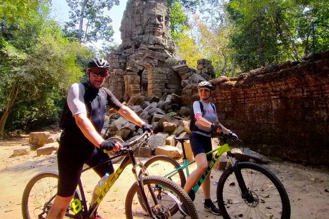 Cycling of the Angkor Temples include Lunch & Snacks - Bayon’s stone faces and everyday scenes