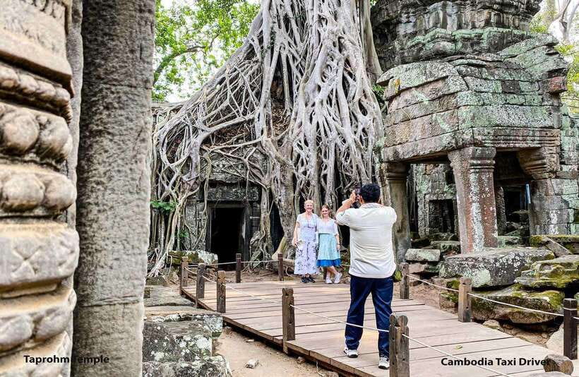 From Phnom Penh: Angkor Wat, Bayon, and Ta Prohm Day Trip - Bayon Temple and its calm stone faces