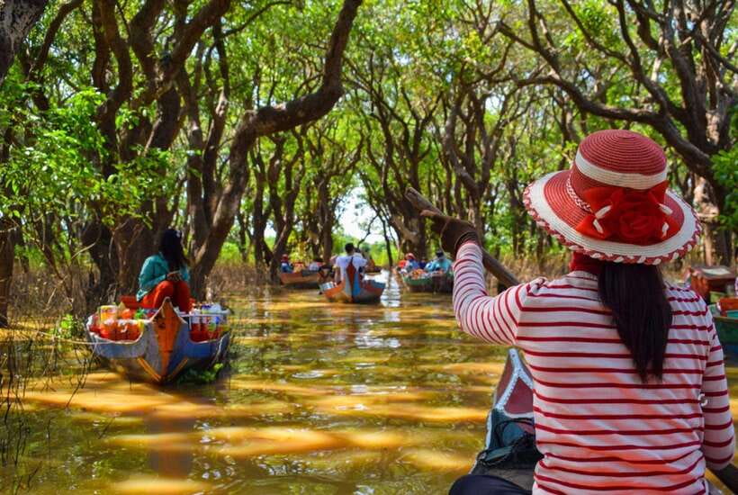 From Siem Reap: Kampong Phluk Floating Village Tour by Boat - The flooded mangroves by small canoe