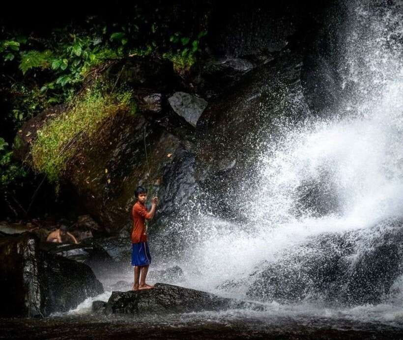Phnom Kulen Waterfall & the Sacred 1000 Lingas (with Lunch) - Reading the 1000 Lingas in the Riverbed
