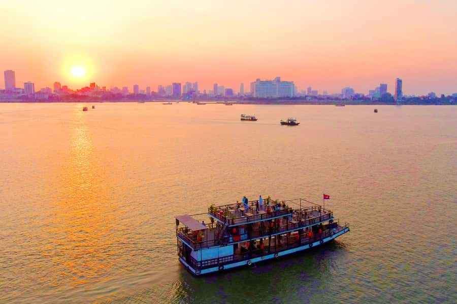 Phnom Penh: Sunset Cruise with Unlimited Beer &Fruit platter - Boarding the boat and settling in