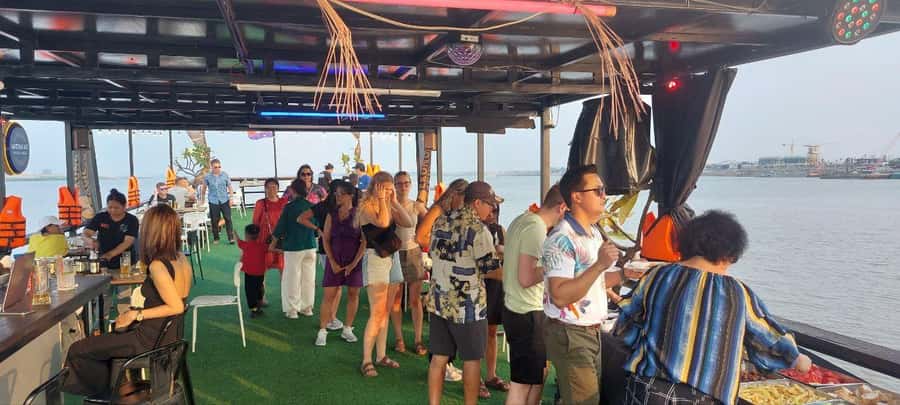 Phnom Penh: Sunset Cruise with Unlimited Beers & BBQ Buffet - From city riverfront to stilt homes