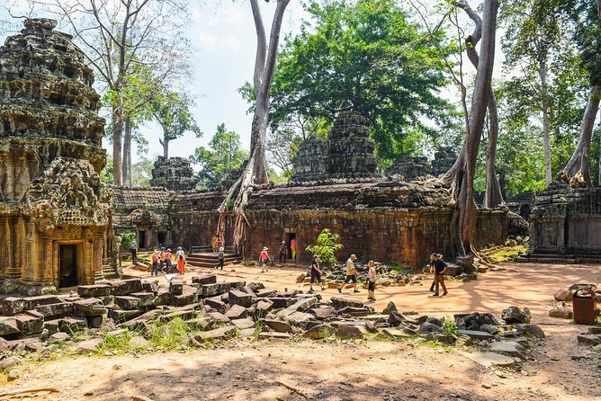 Private Full-Day Angkor Temple and Sunset Viewing with Lunch - Angkor Thom and the Bayon, where faces watch from the stone