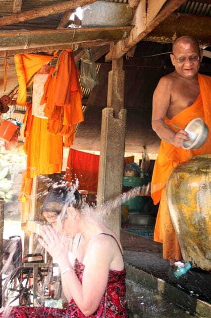 Siem Reap: 1-Hour Cambodian Buddhist Water Blessing - The red wrist ties after the blessing