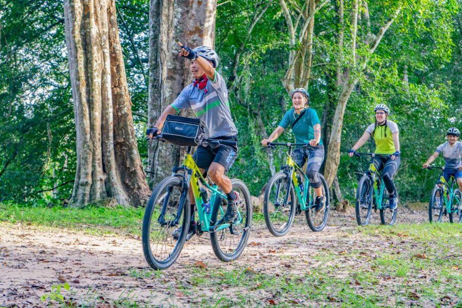 Siem Reap: Angkor Sunset Bike & Boat Tour /E-Bike Available - The Dragon Boat sunset on an ancient waterway
