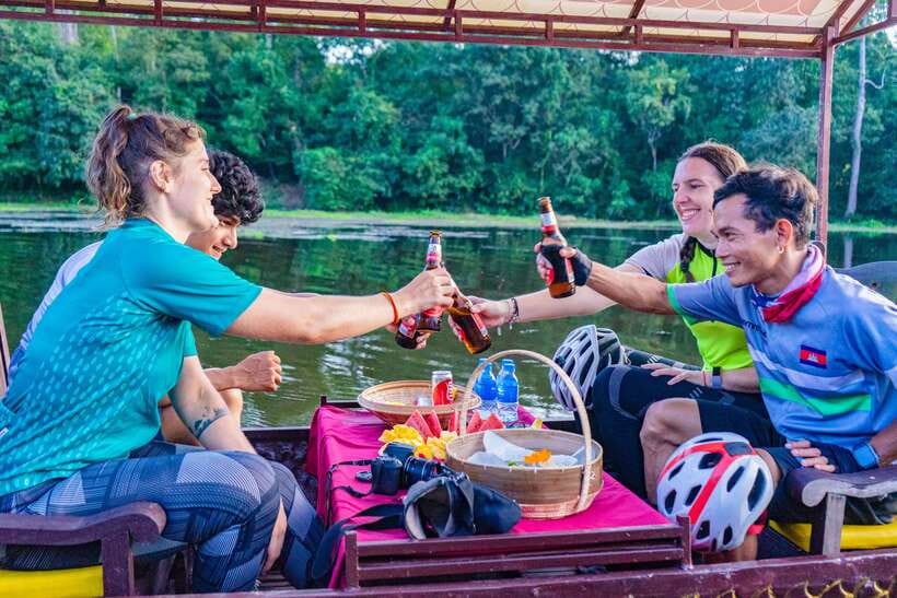 Siem Reap: Angkor Sunset Bike & Boat Tour /E-Bike Available - Riding behind Angkor Wat