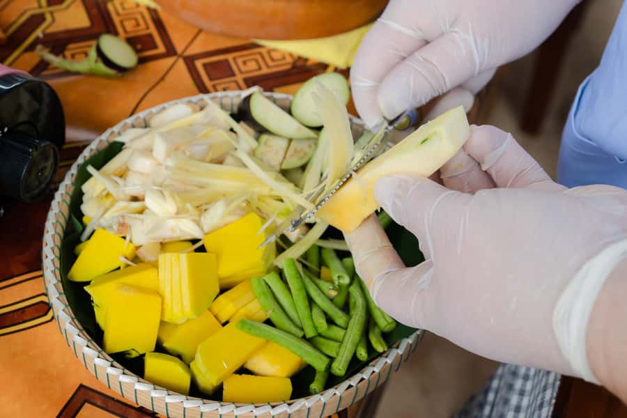 Siem Reap: Authentic Eco Village Walk and Cooking Class Tour - Picking organic ingredients for an authentic Khmer meal