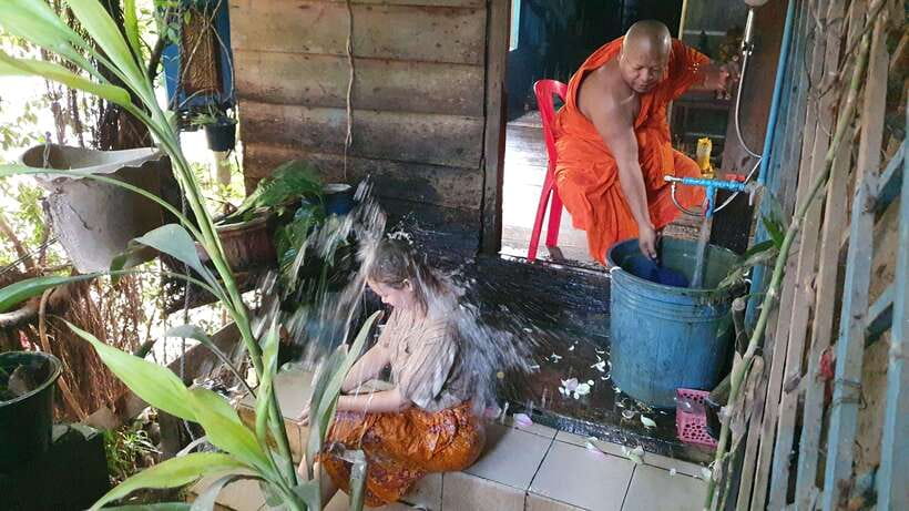 Siem Reap Cambodian Buddhist Water Blessing and Local Market - What the chanting and red wrist ties mean to your visit