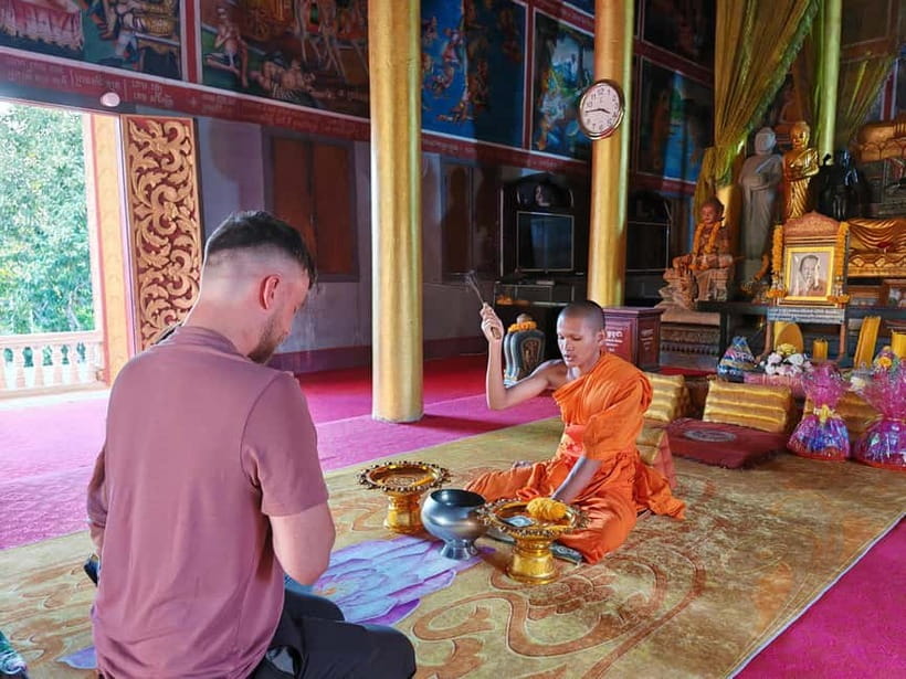 Siem Reap: Monk Blessings and Village Life Scooter Tour - Meeting a monk beside the Angkorian reservoir