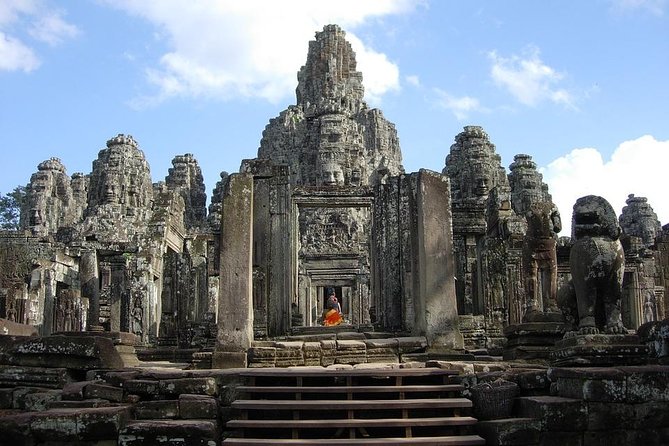 The Angkor Temples from Sunrise by Tuk Tuk - Bayon Temple and its many stone faces