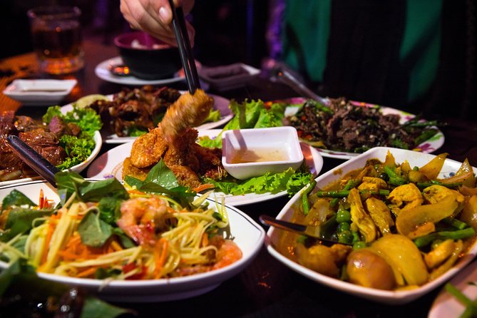 Ultimate Phnom Penh Food Tour by Tuk Tuk: 20 Tastings and Drinks - Russian Market after dark and smoky pork ribs
